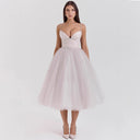Chic Cocktail Dress with Adjustable Straps and Shimmering Overlay