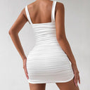Chic Figure-Hugging Mini Dress with Spaghetti Straps and Ruffle Accents