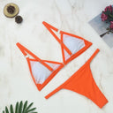 Chic Two-Piece Bikini Set with Gold Accents and Triangle Cups